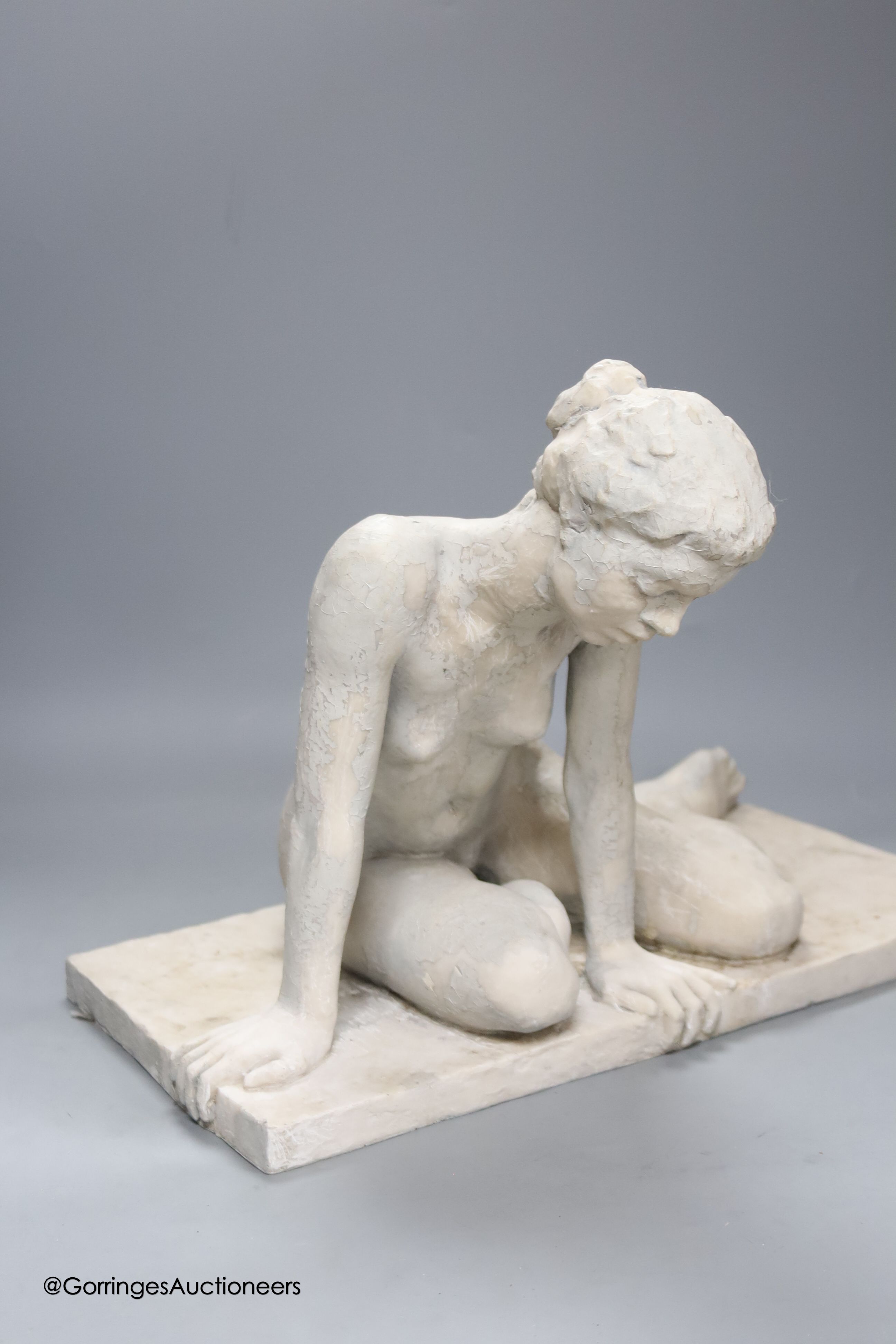 A composite figure of a seated nude, width 44cm height 32cm